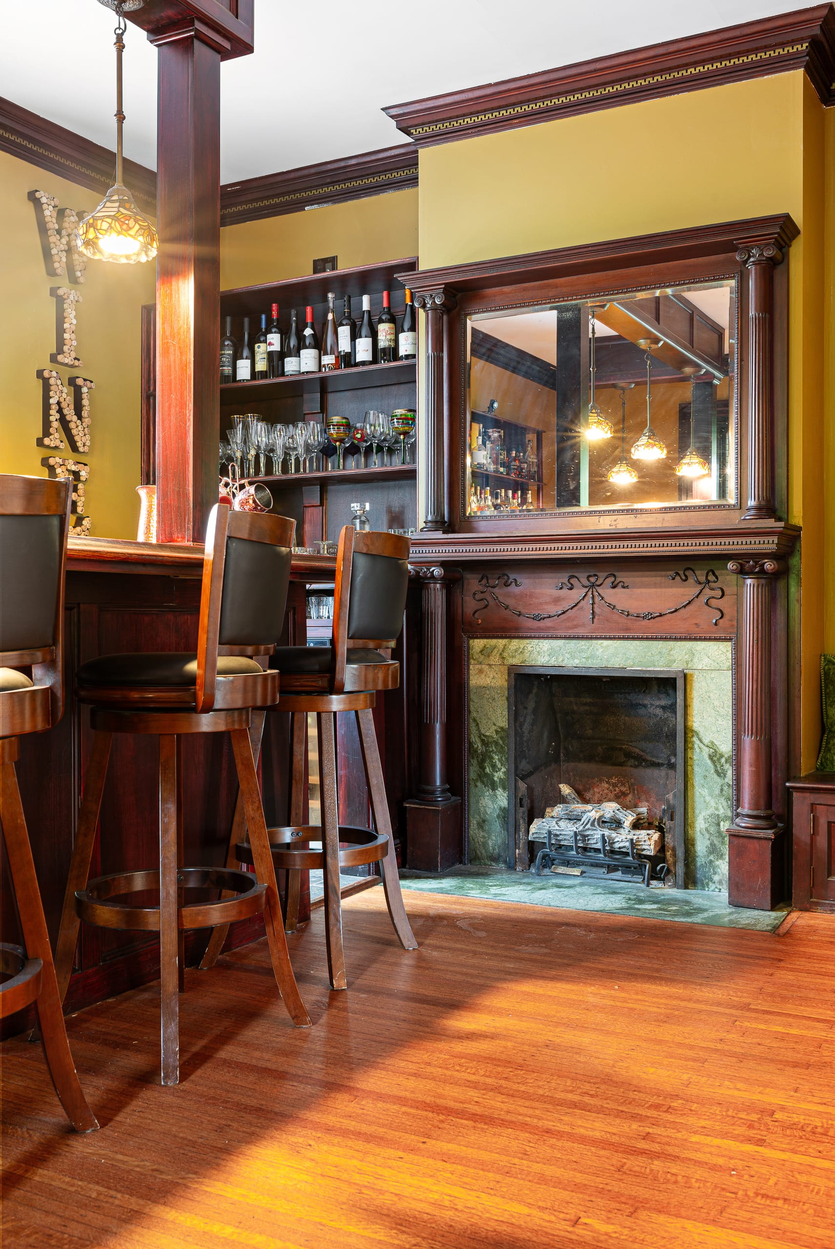 Parlor with custom wet bar and fireplace