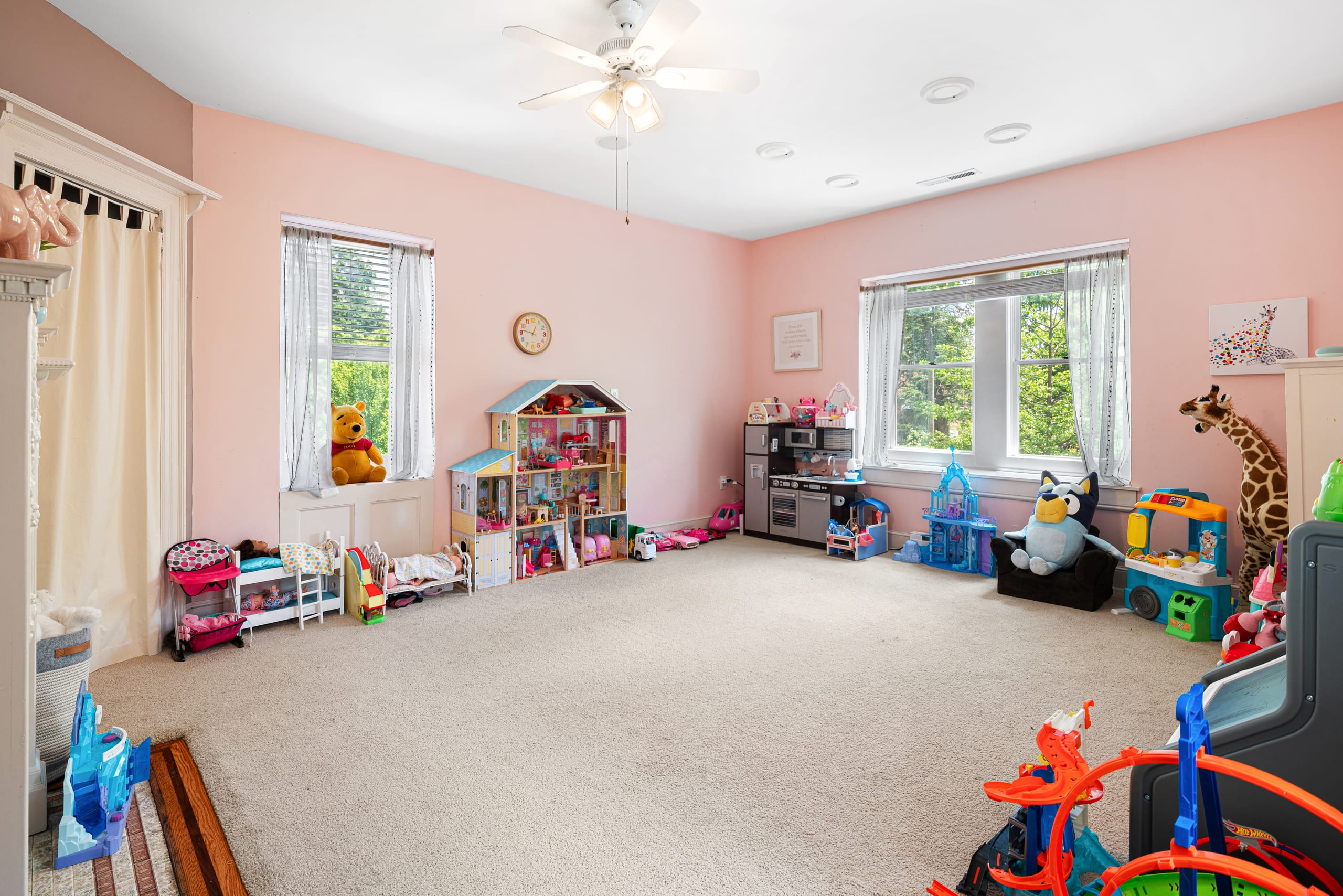 Spacious pink room with twin windows