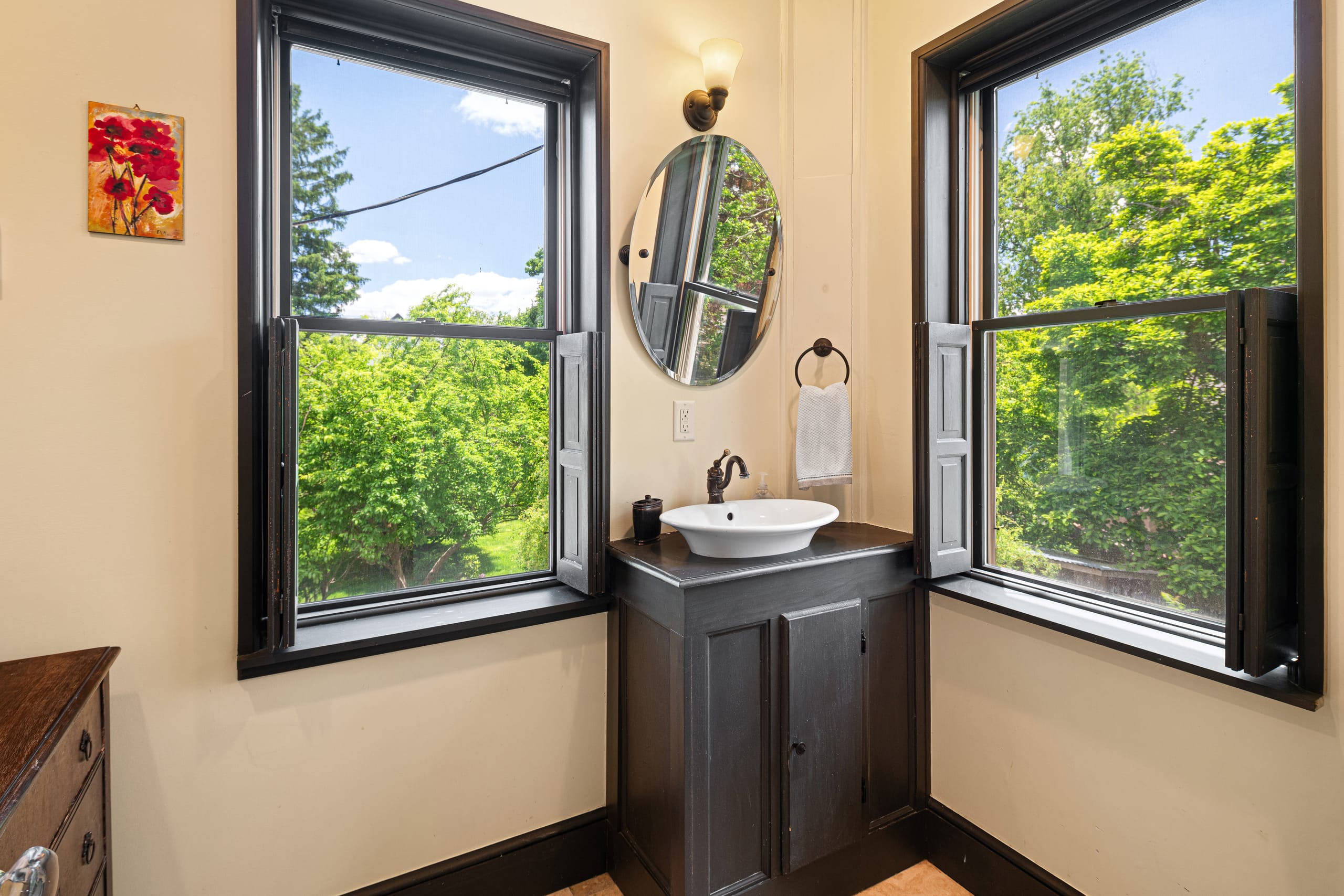 Corner vessel vanity, twin windows