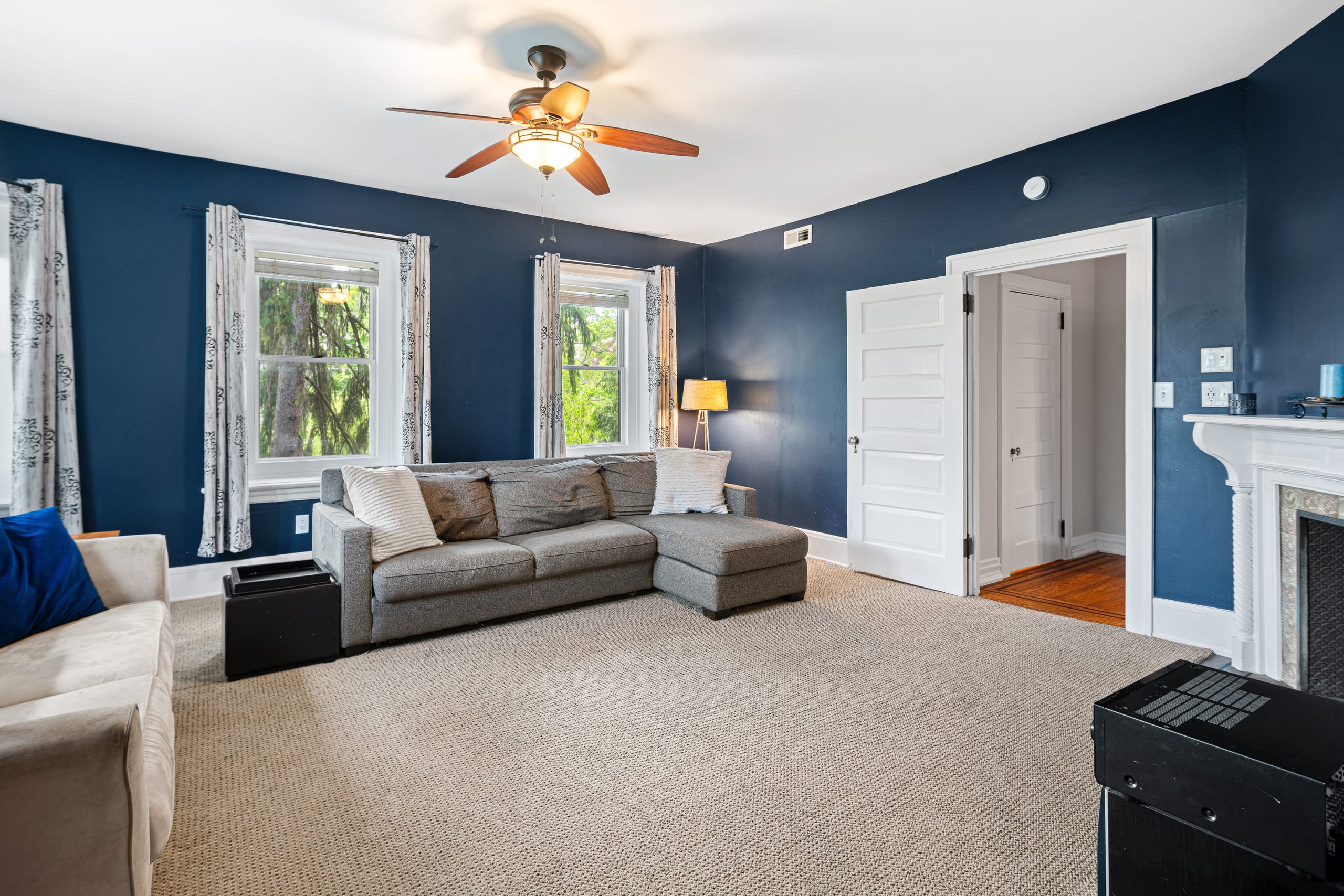 Navy bedroom with marble fireplace