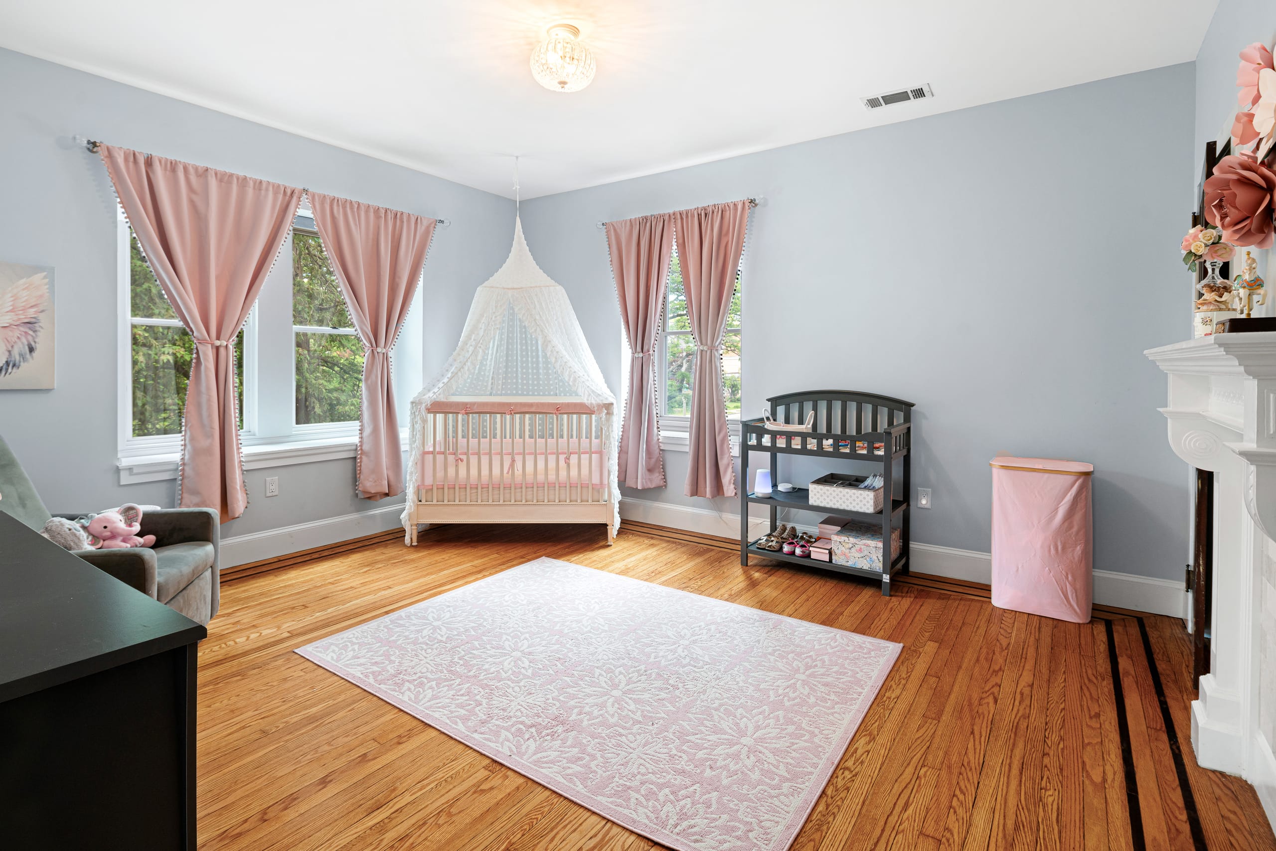 Serene blue nursery with canopy crib