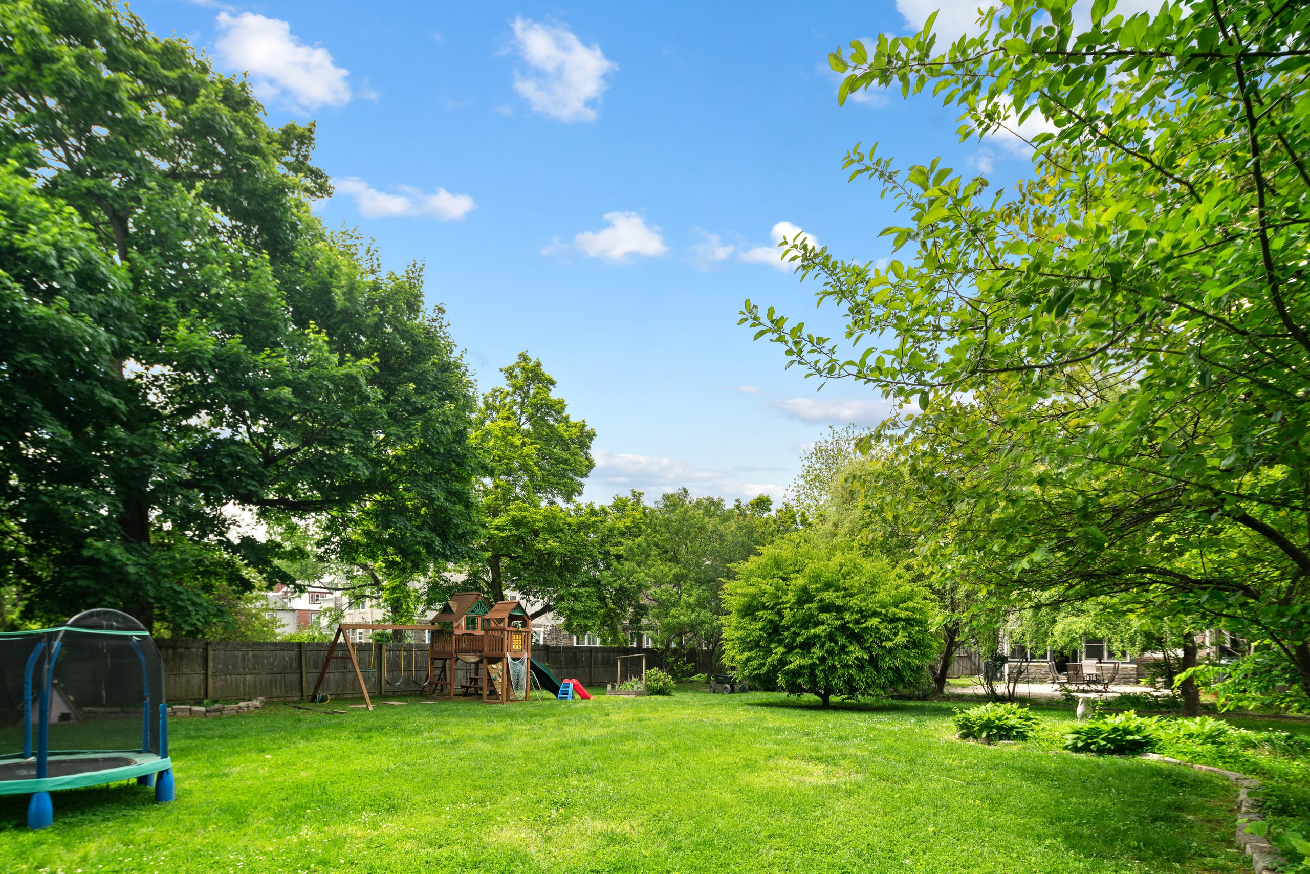 Expansive lawn under mature canopy