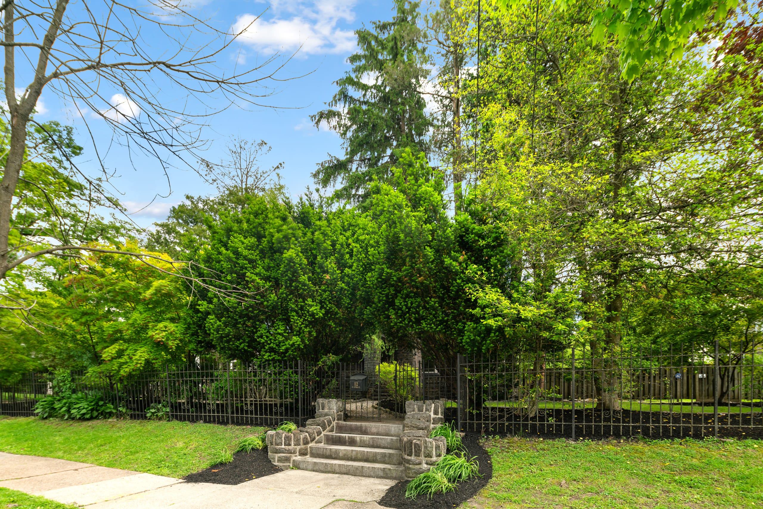 Stone steps & gated garden entrance
