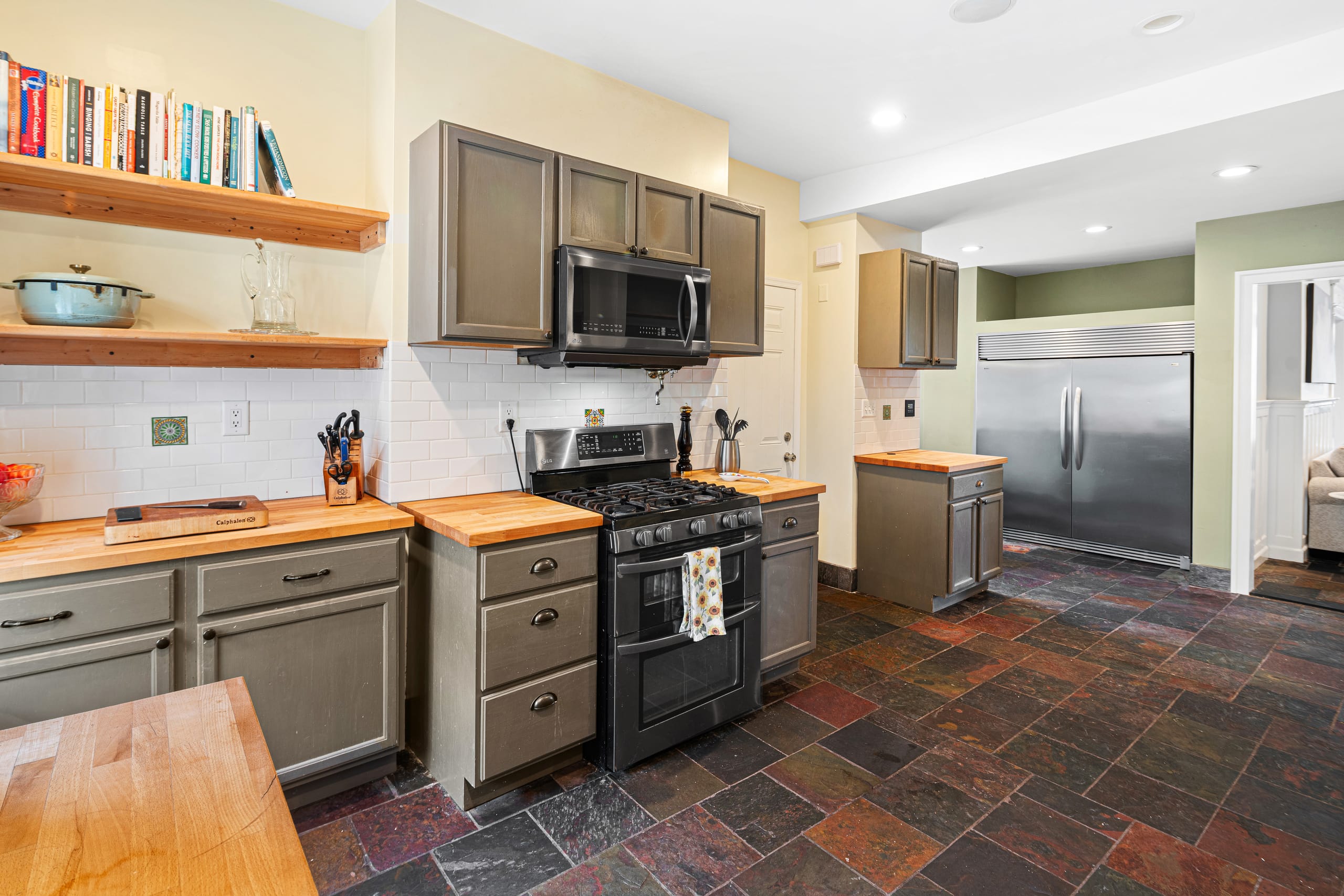 Kitchen with stainless range and butcher block